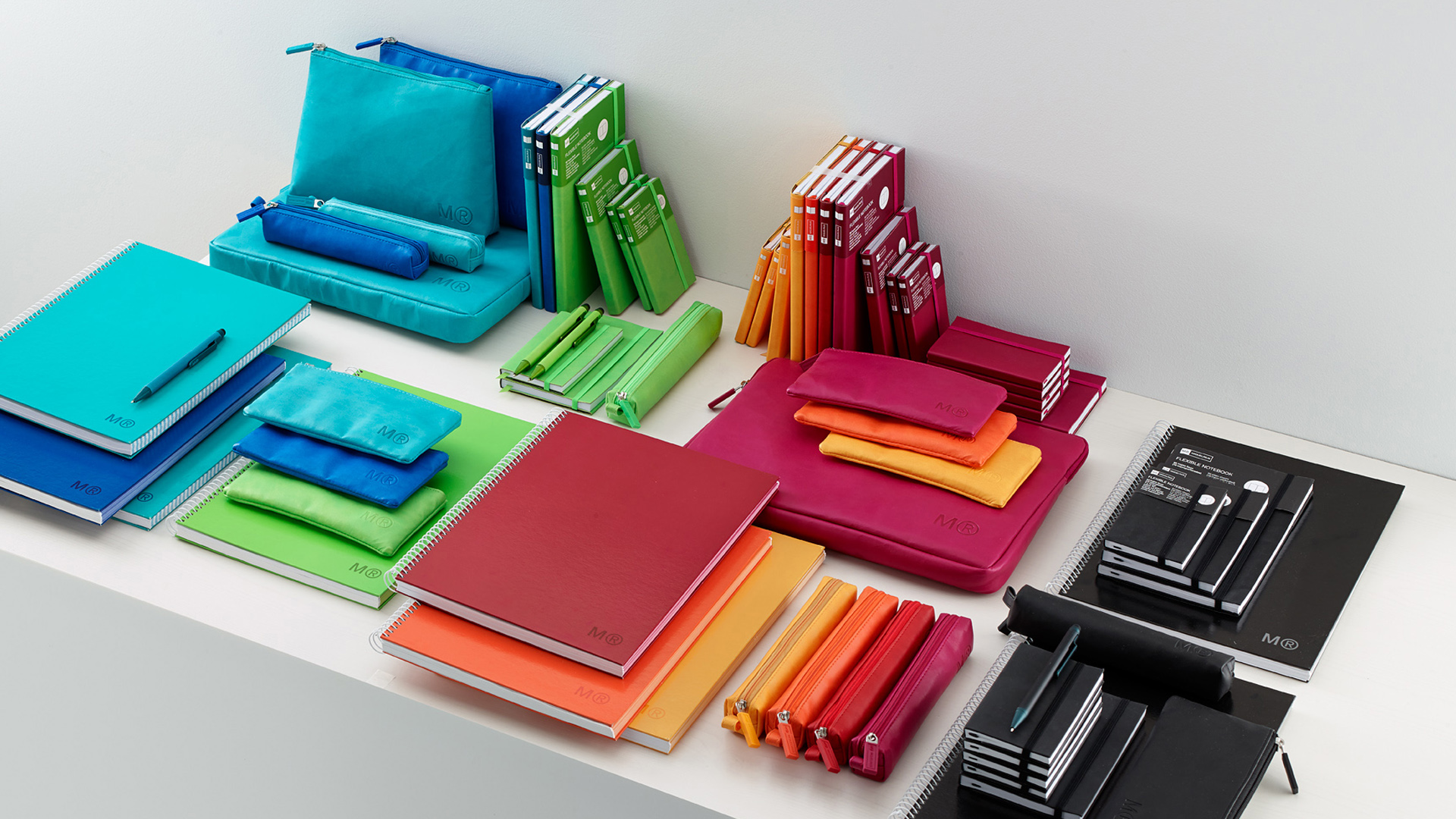 Colección completa de productos Miquelrius clasificados por colores. Proyecto de branding desarrollado por Nomon Design, agencia de branding.