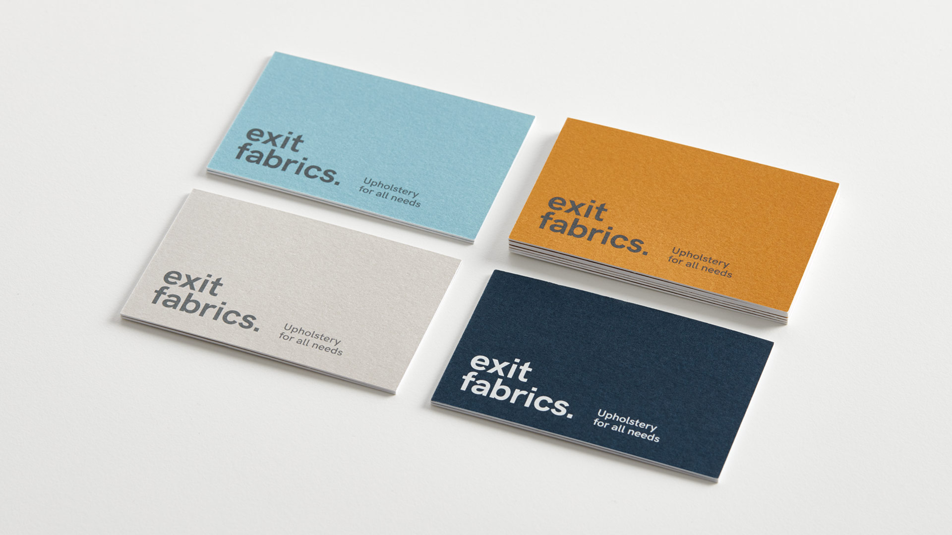 Nueva estrategia de branding aplicada en tarjetas para Exit Fabrics por Nomon Design, agencia de branding