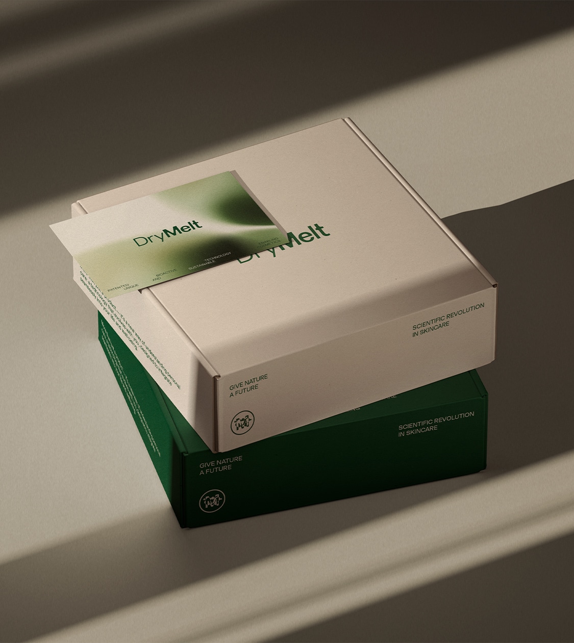 Cajas corporativas y tarjeta de presentación de DryMelt, desarrollada por Nomon Design, agencia de branding.